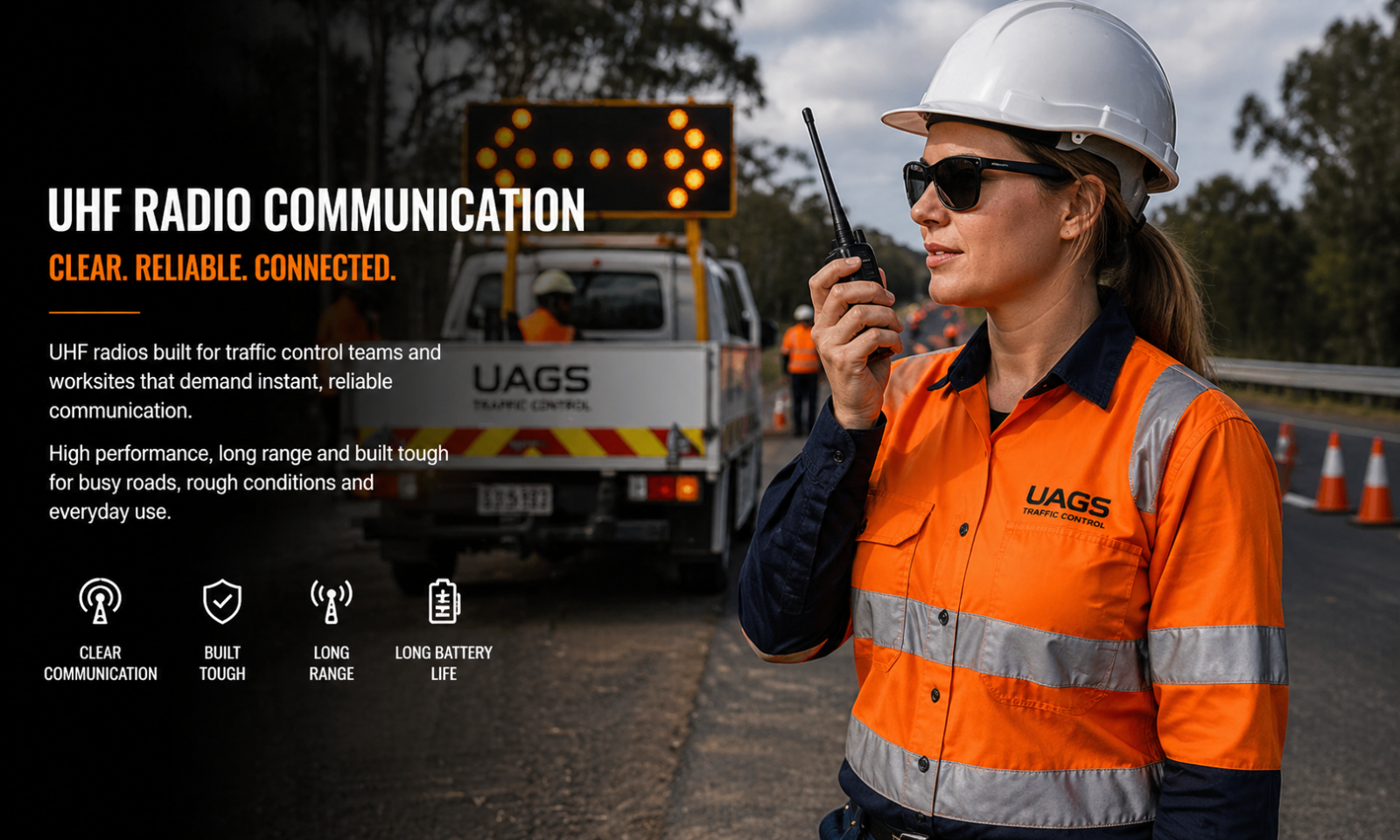 Traffic controller using handheld UHF radio on roadside worksite with traffic management vehicle and arrow board